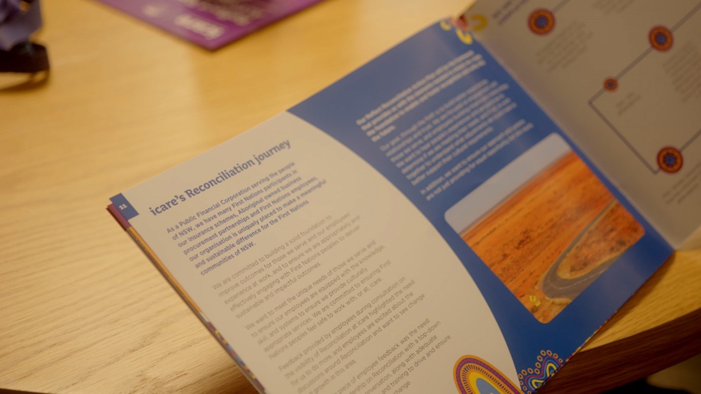 icare Reconciliation Action Plan booklet opened to a page titled icare's reconciliation journey